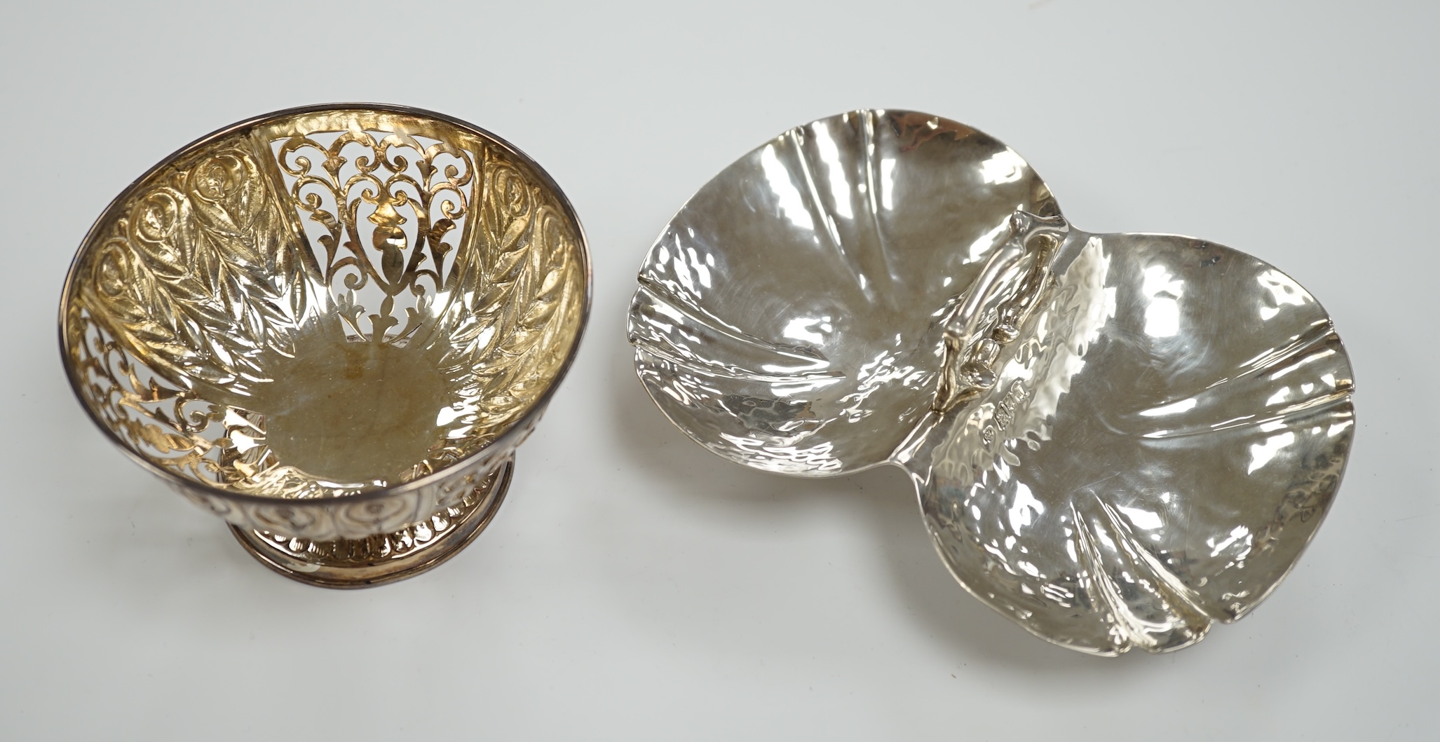 An Edwardian Arts & Crafts silver single handle two division dish, by Charles Edwards, London, 1904, 16.3cm and a modern pierced silver bowl, 9.4oz.